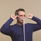 Man adjusting the Nuance CPAP Mask.