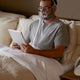 Man reading with Amara full face mask on his face