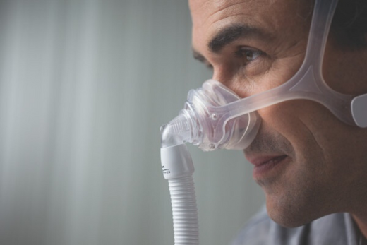 A man wearing a CPAP mask before bed