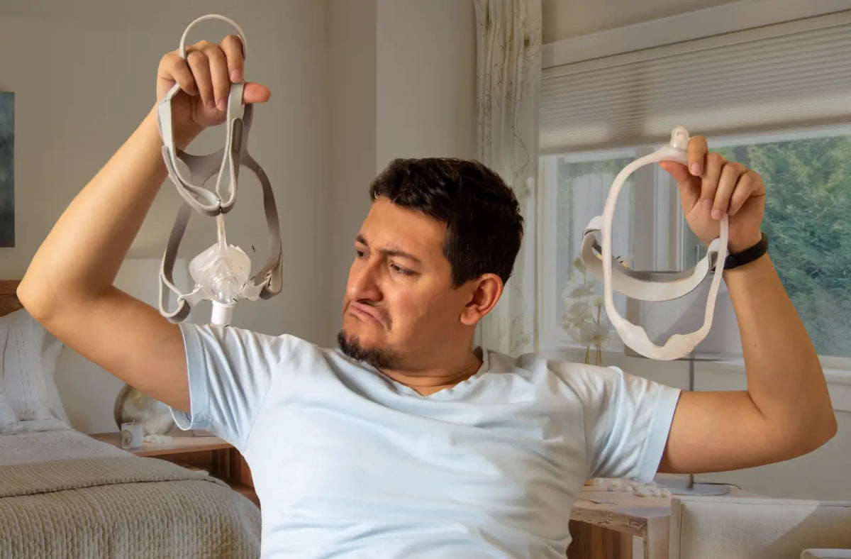 Men holding cpap mask
