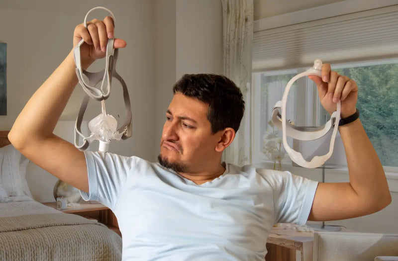 Men holding cpap mask