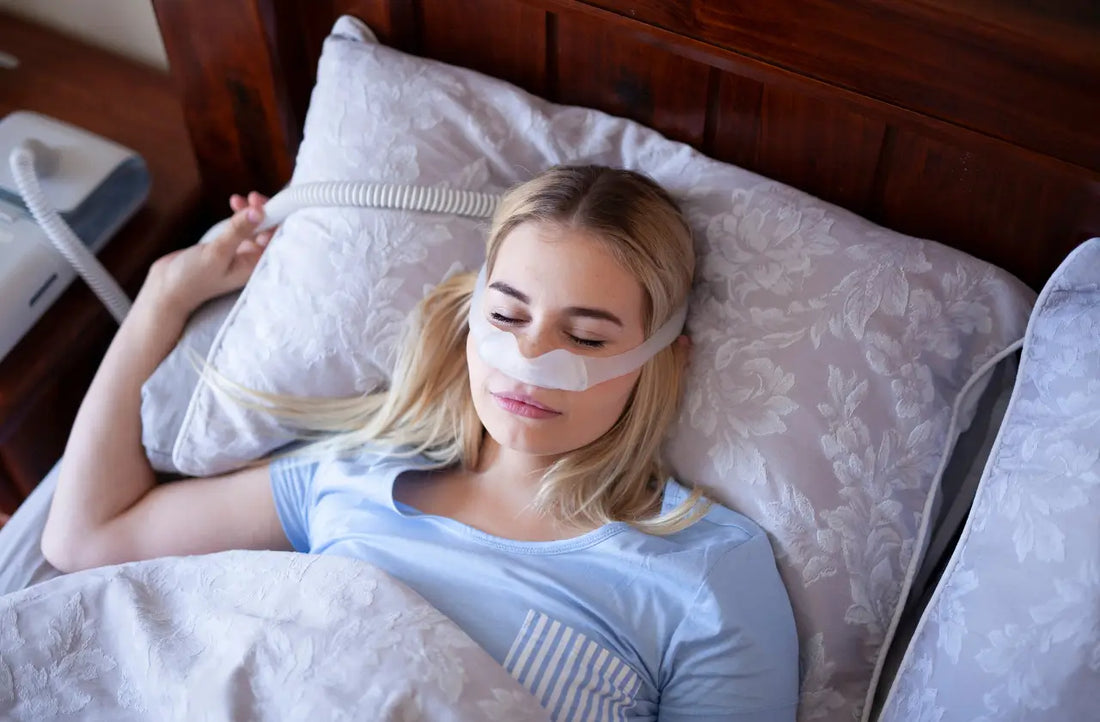 Woman with undiagnosed sleep apnea lying awake in bed at night