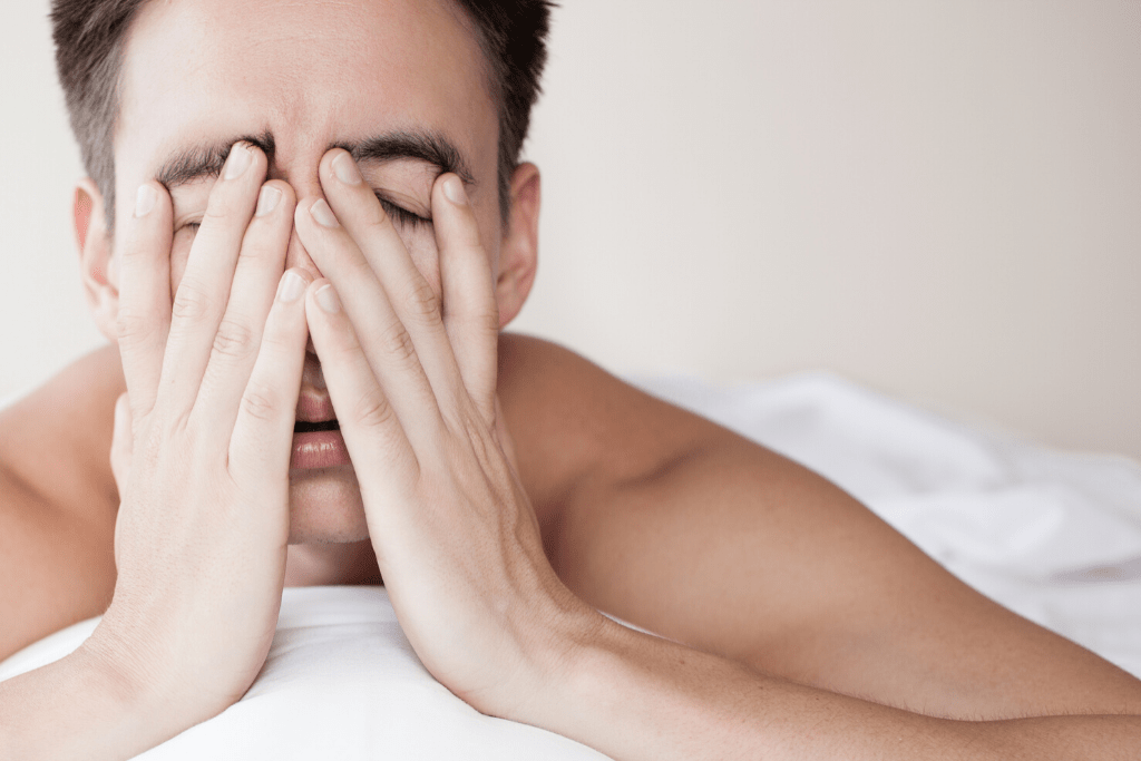 Man with his palms in his face