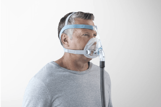 Man standing while wearing a Nasal CPAP Mask