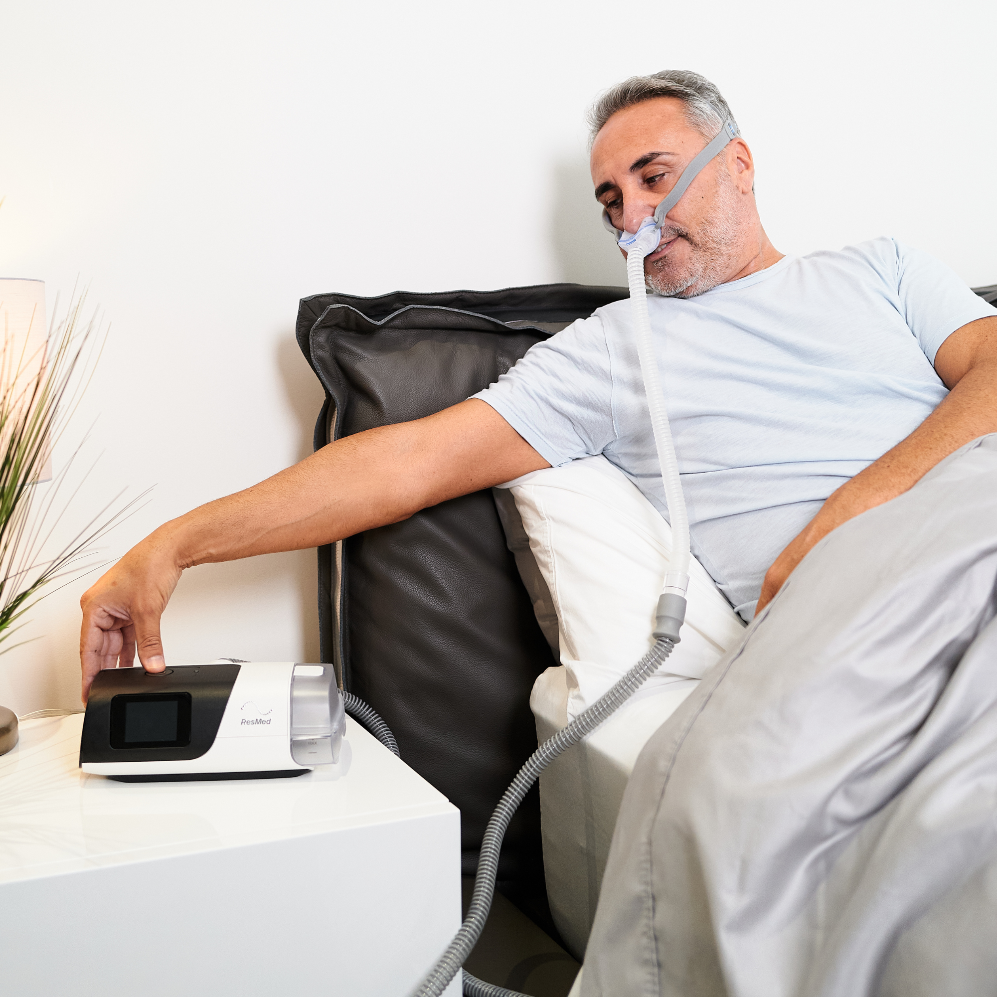 View of man wearing AirFit P10 in bed