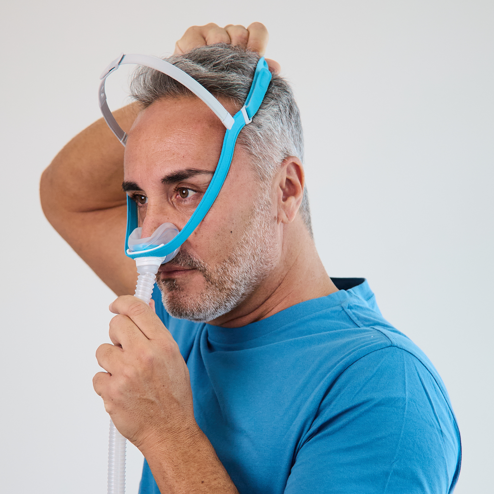 View of man putting Evora mask.