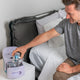 Man putting mask into Lumin CPAP cleaner.