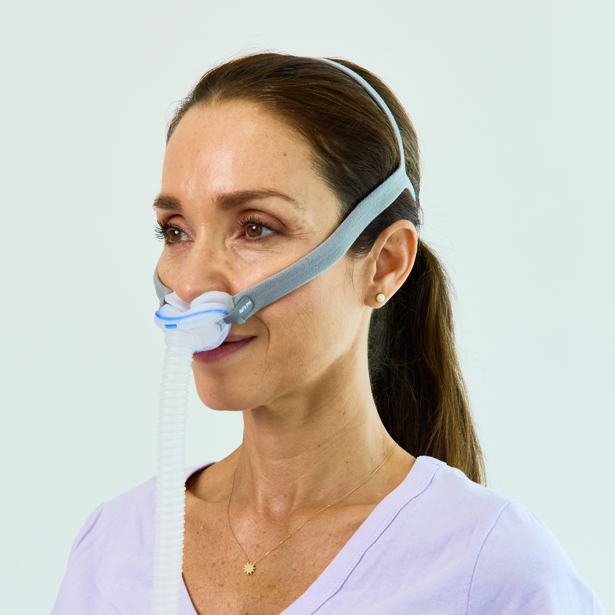 Side view of women wearing the AirFit P10 For Her.