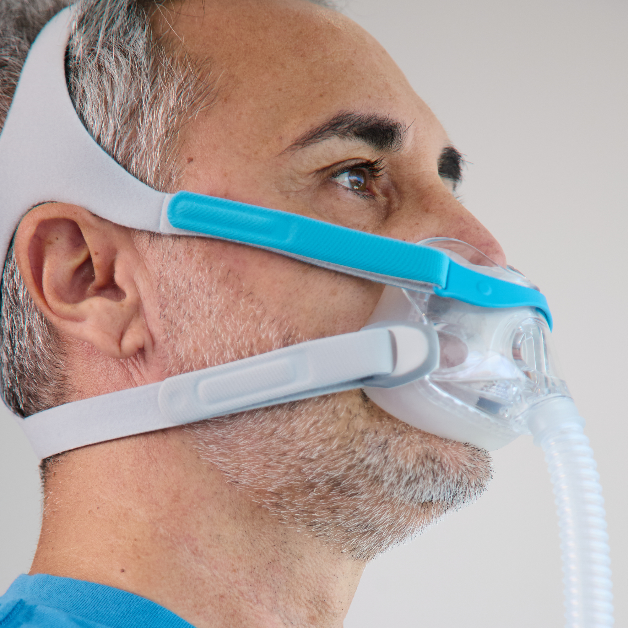 Side view of man wearing the Evora full face CPAP mask.