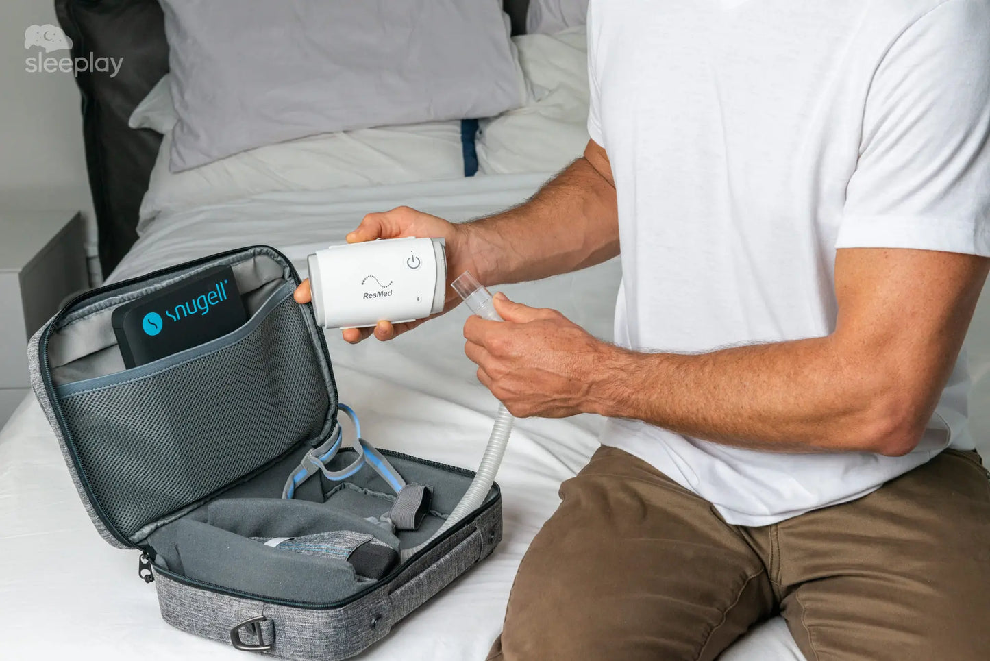 Men assembling AirMini Travel CPAP. 