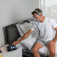 Man adjusting CPAP machine wearing the Vitera CPAP mask.