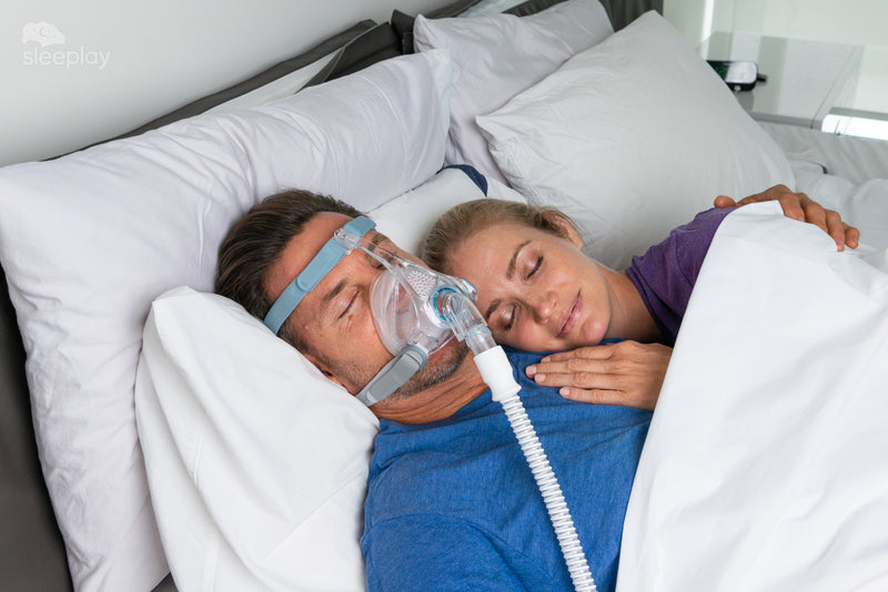 Man sleeping with woman wearing Vitera.
