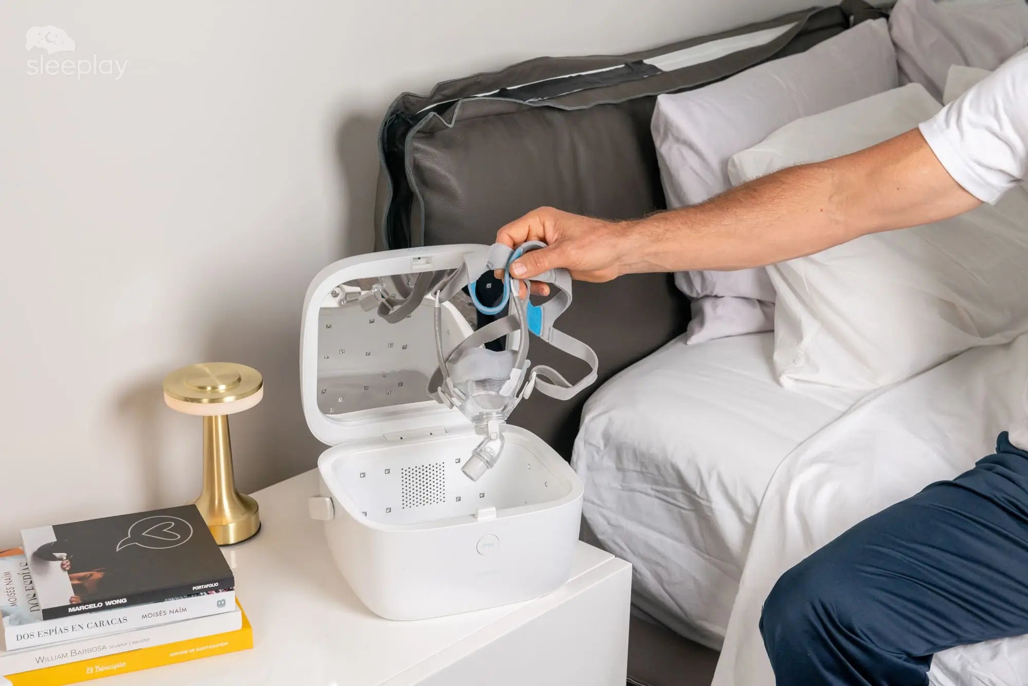 Putting CPAP mask in paptizer CPAP cleaner.