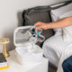 Putting CPAP mask in paptizer CPAP cleaner.