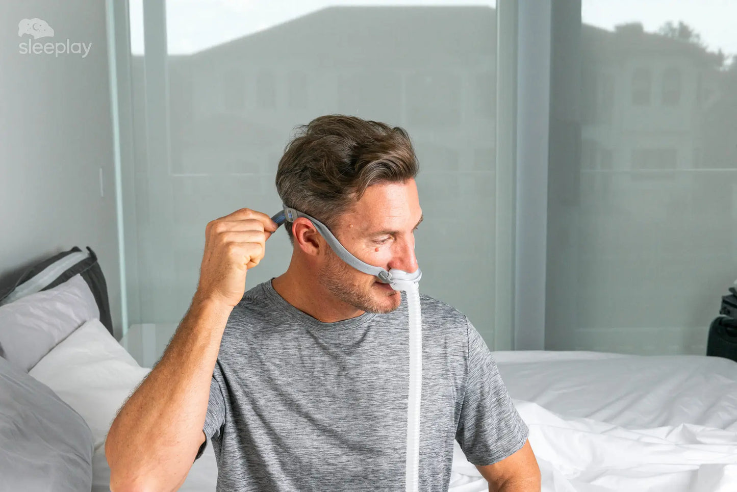 Men adjusting AirFit P10 CPAP.