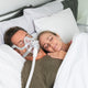 Couple sleeping with AirFit F20.