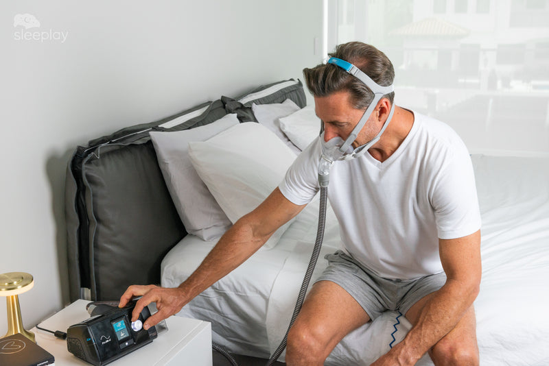 Man using AirSense 10 with AirFit F30.