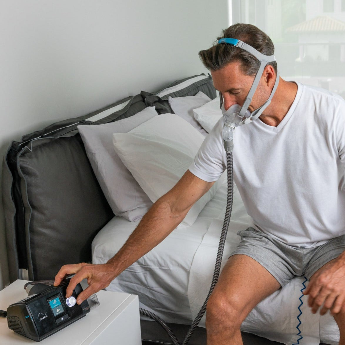 Man using ResMed AirSense 10.