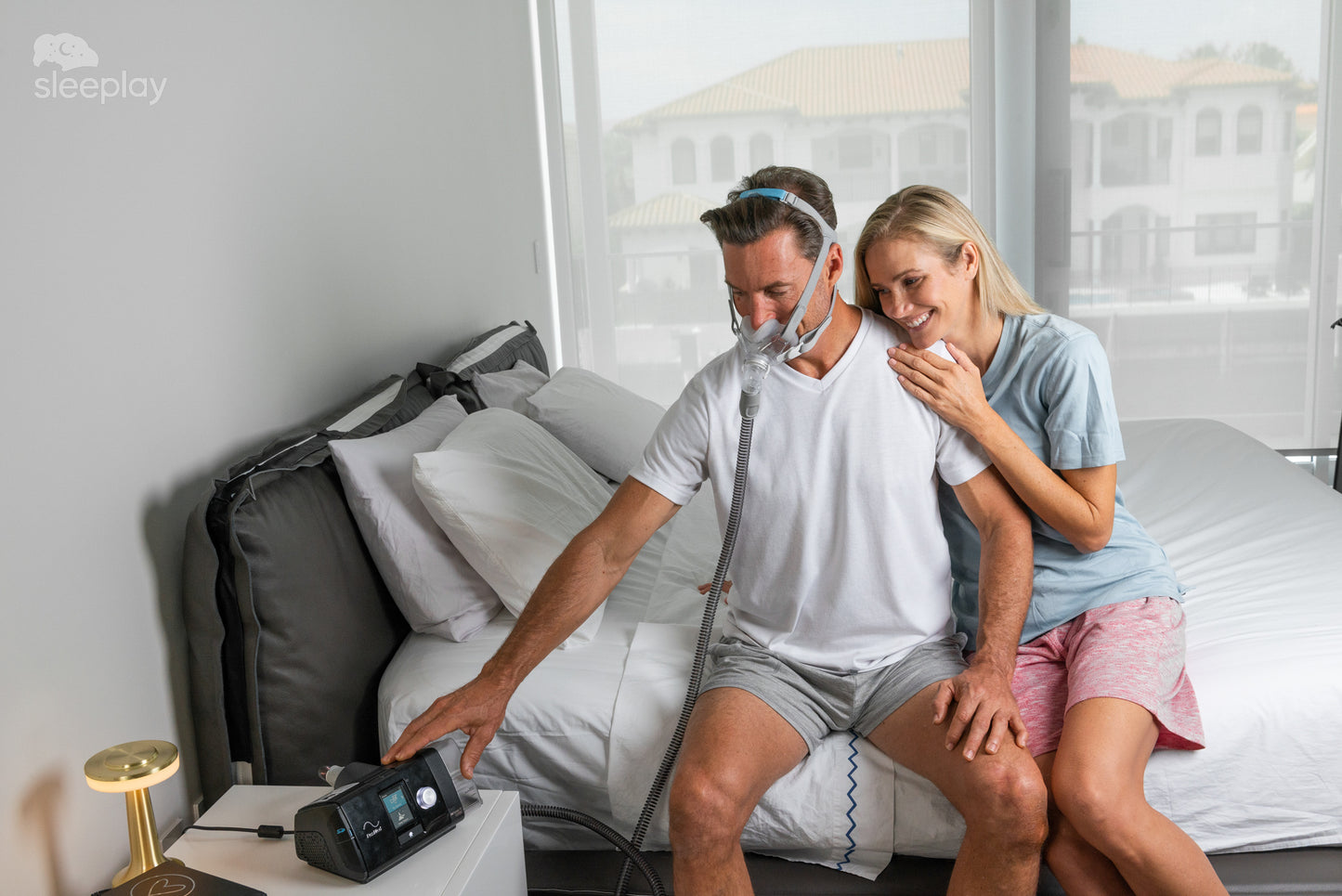 Couple looking at the ResMed AirSense 10