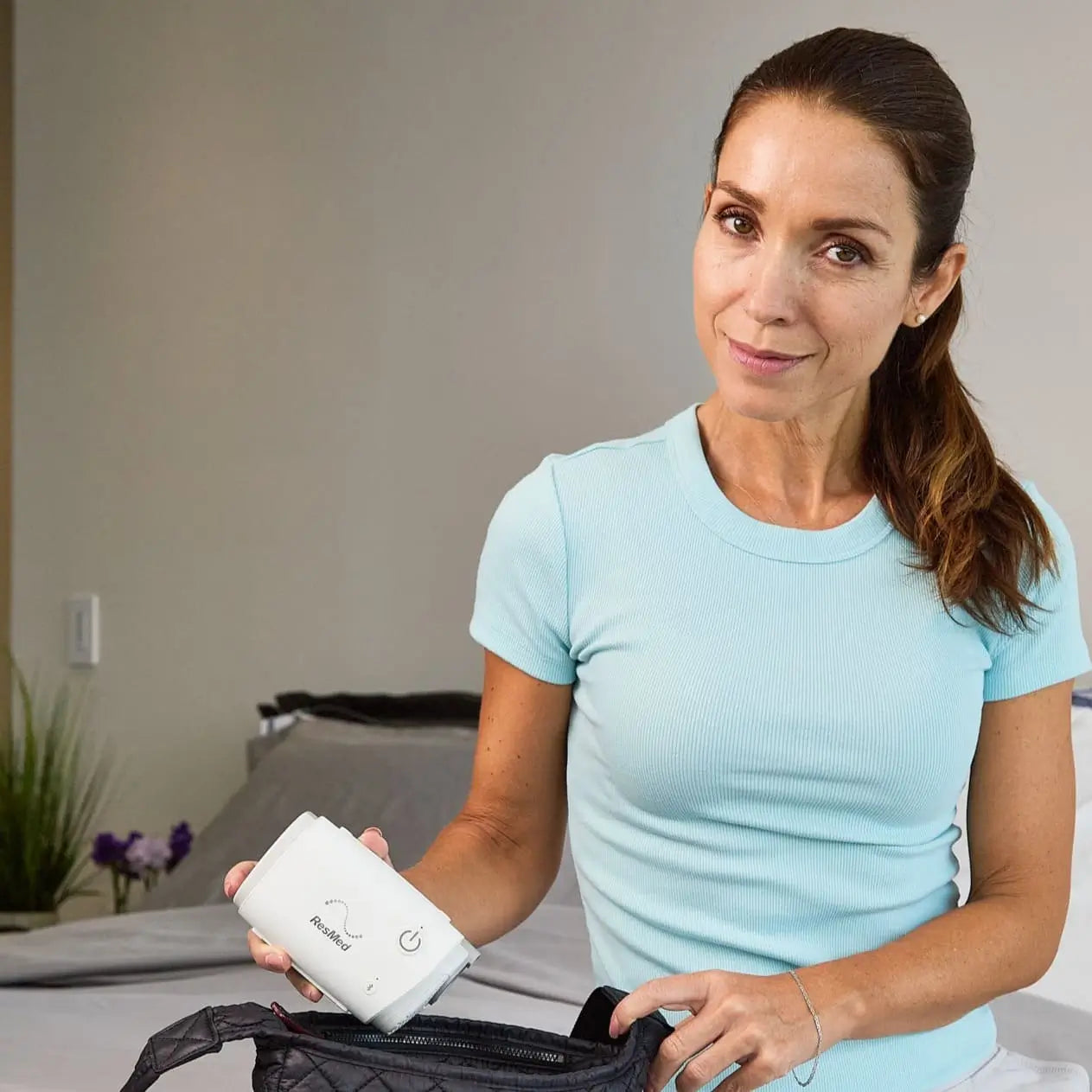 Woman putting away her AirMini