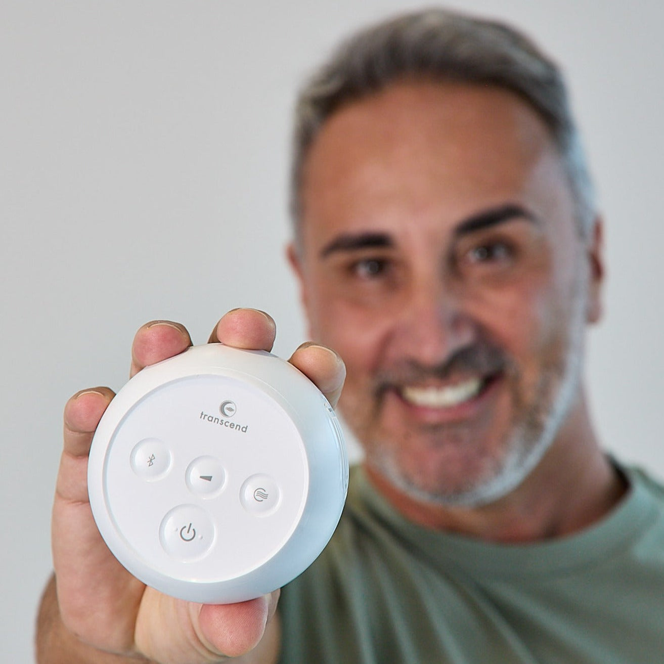 Man holding Micro cpap machine 