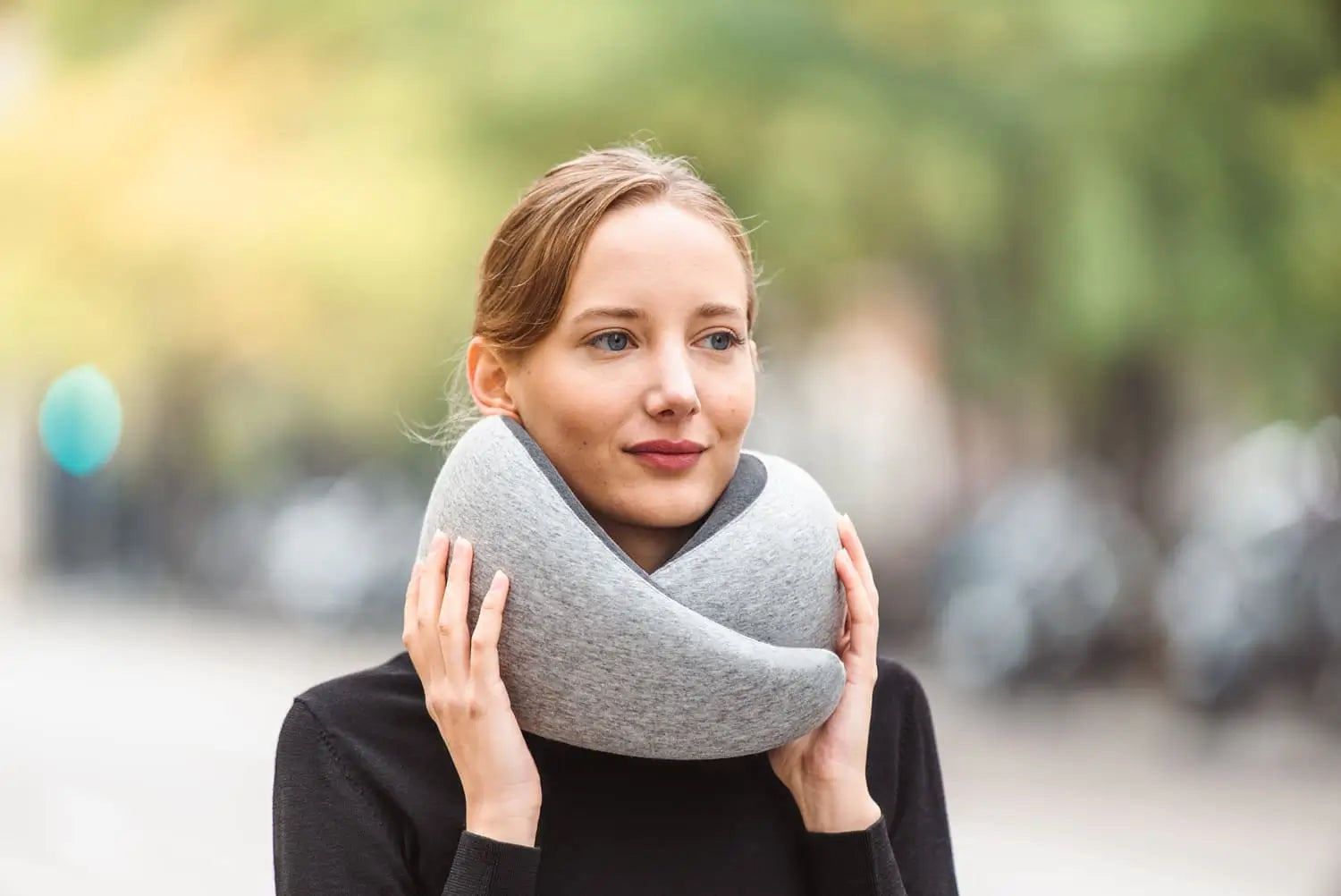 Woman On Street Wearing Midnight Grey Neck Pillow.