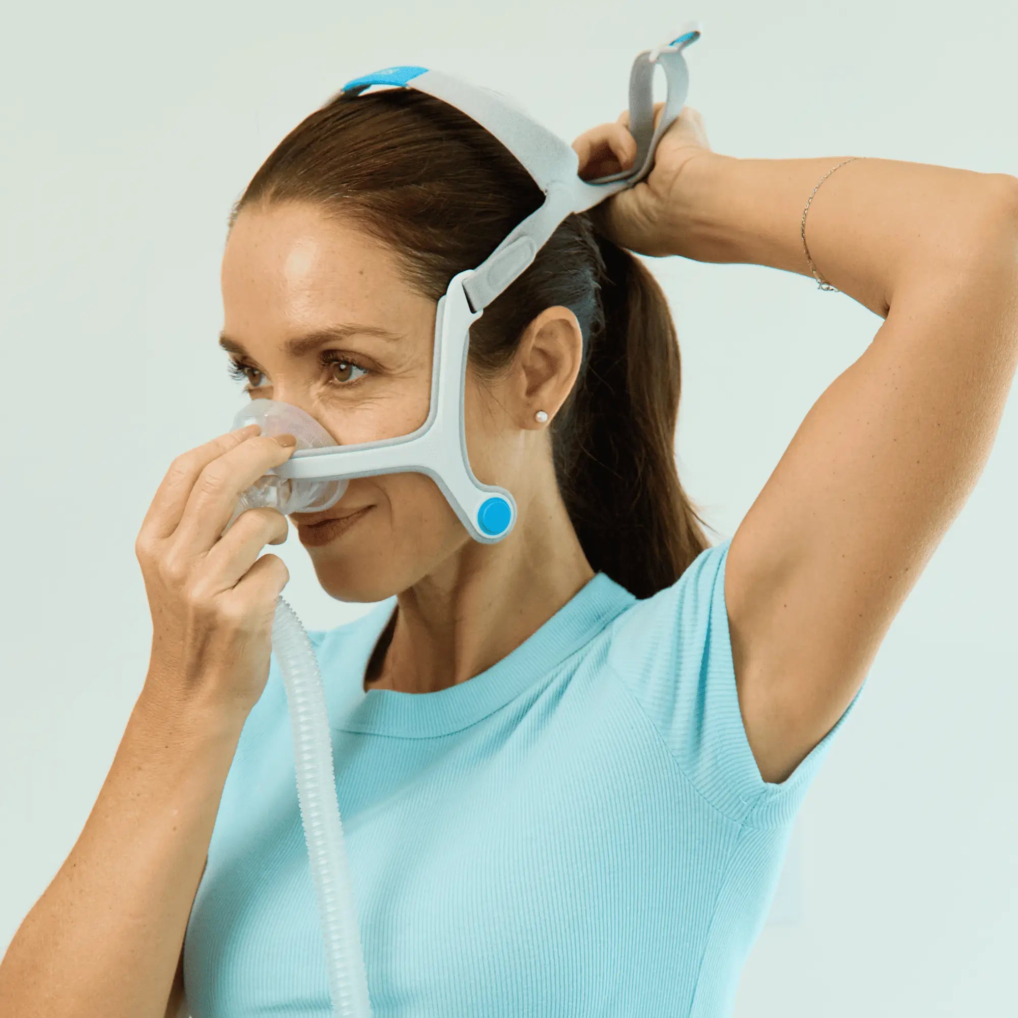 Woman wearing a ResMed AirFit™ N20 for Her Nasal CPAP Mask with Headgear