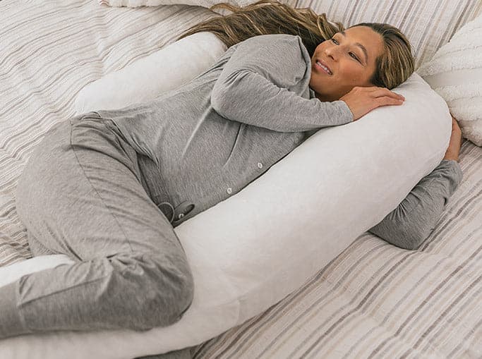woman using the MedCline Therapeutic Full Body Pillow with Memory Foam