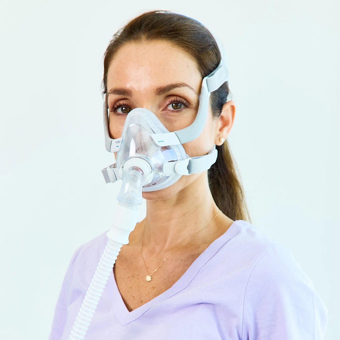 Woman wearing ResMed AirFit F20 Full Face Mask with Headgear Front.