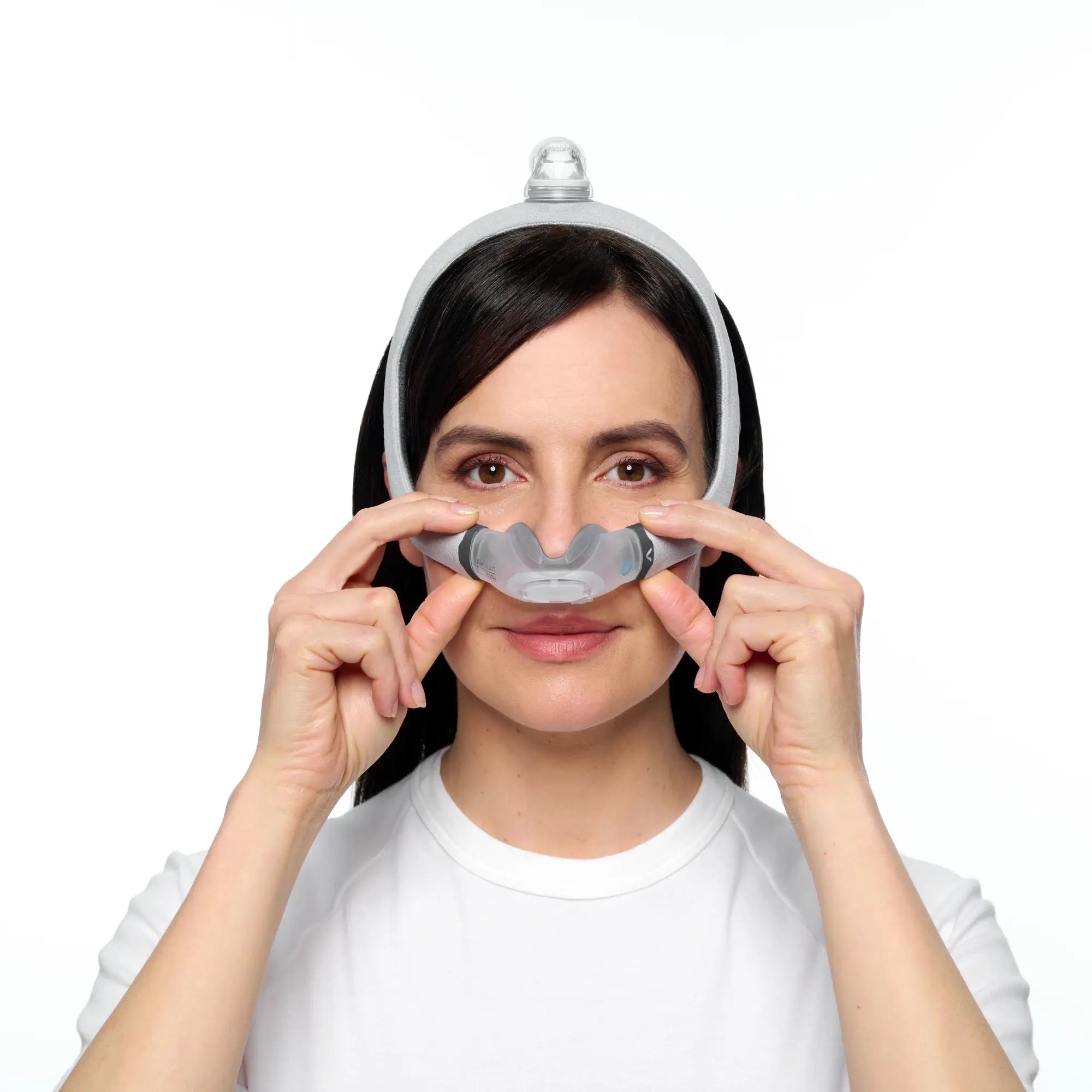 Woman fitting the ResMed AirTouch N30i Nasal CPAP Mask