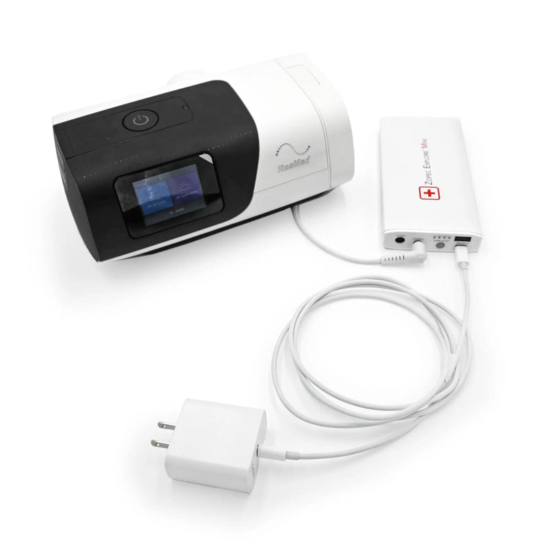 CPAP Travel Battery Explore Mini, a travel essential for CPAP therapy users, displayed with an AirSense 11 and usb c port