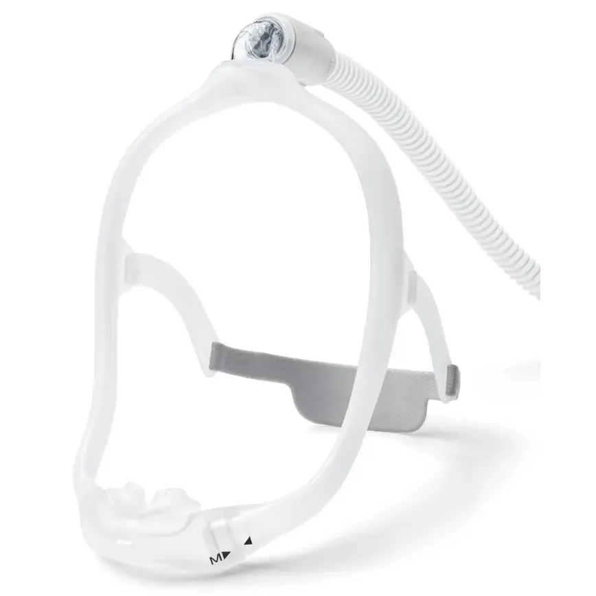 DreamWear silicone nasal pillow CPAP mask, side profile with under-the-nose cushion and gray fabric frame wraps