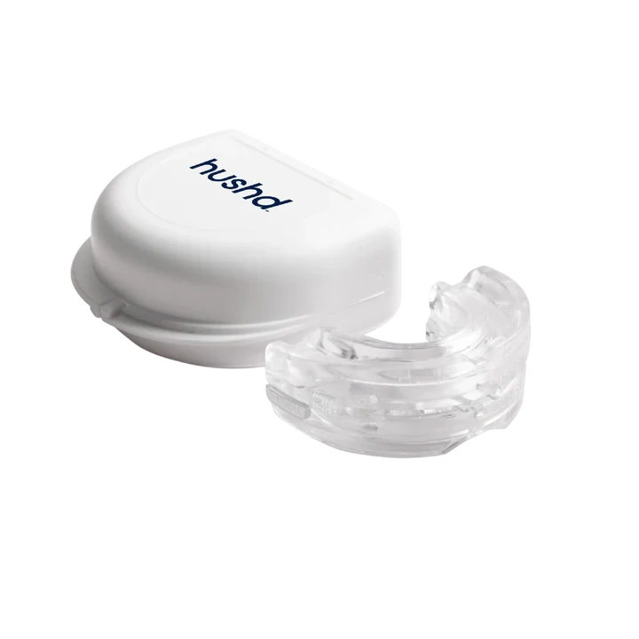 Hushd Avera anti-snoring mouthpiece next to its white storage case