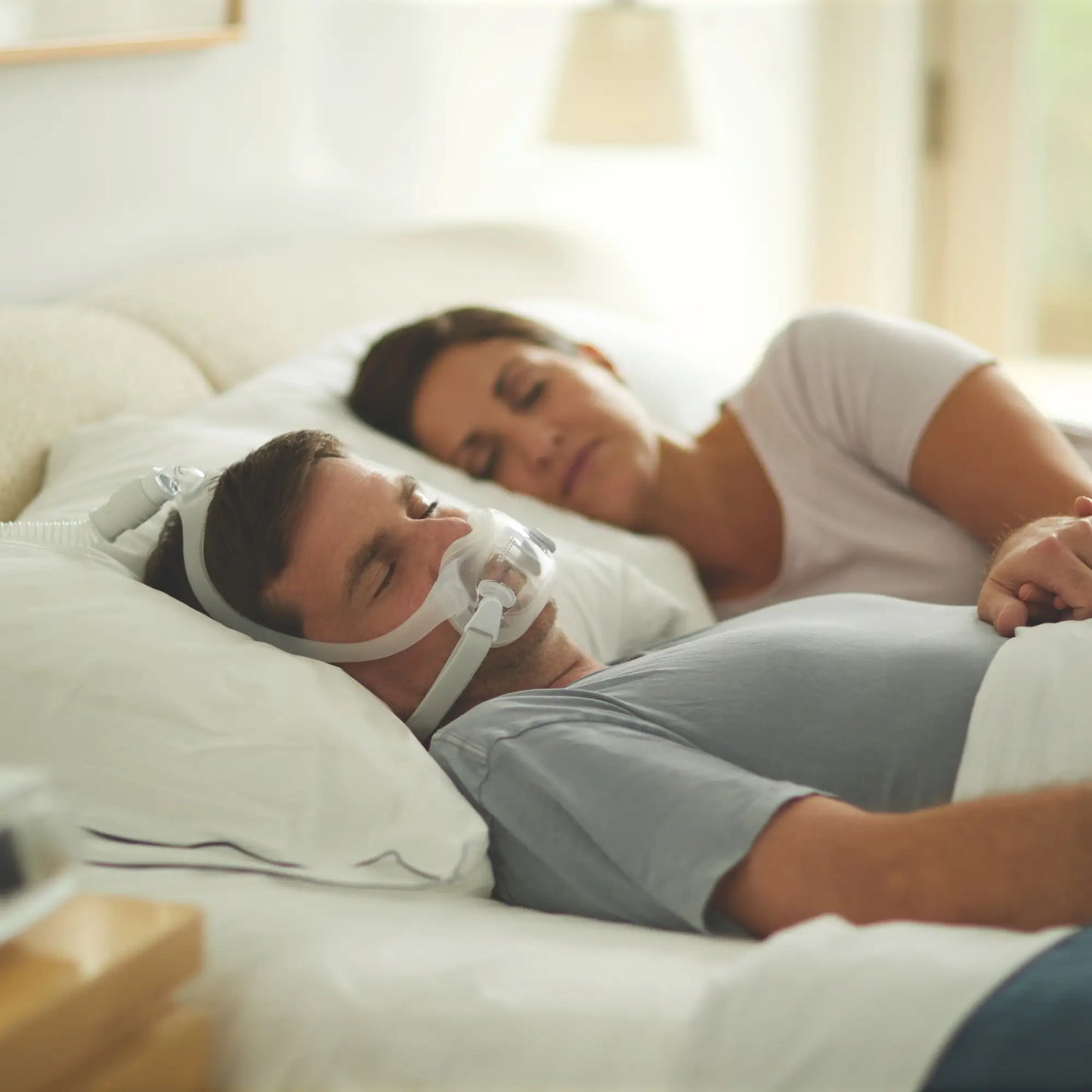 man sleeping with the DreamWear Full Face CPAP Mask with Headgear