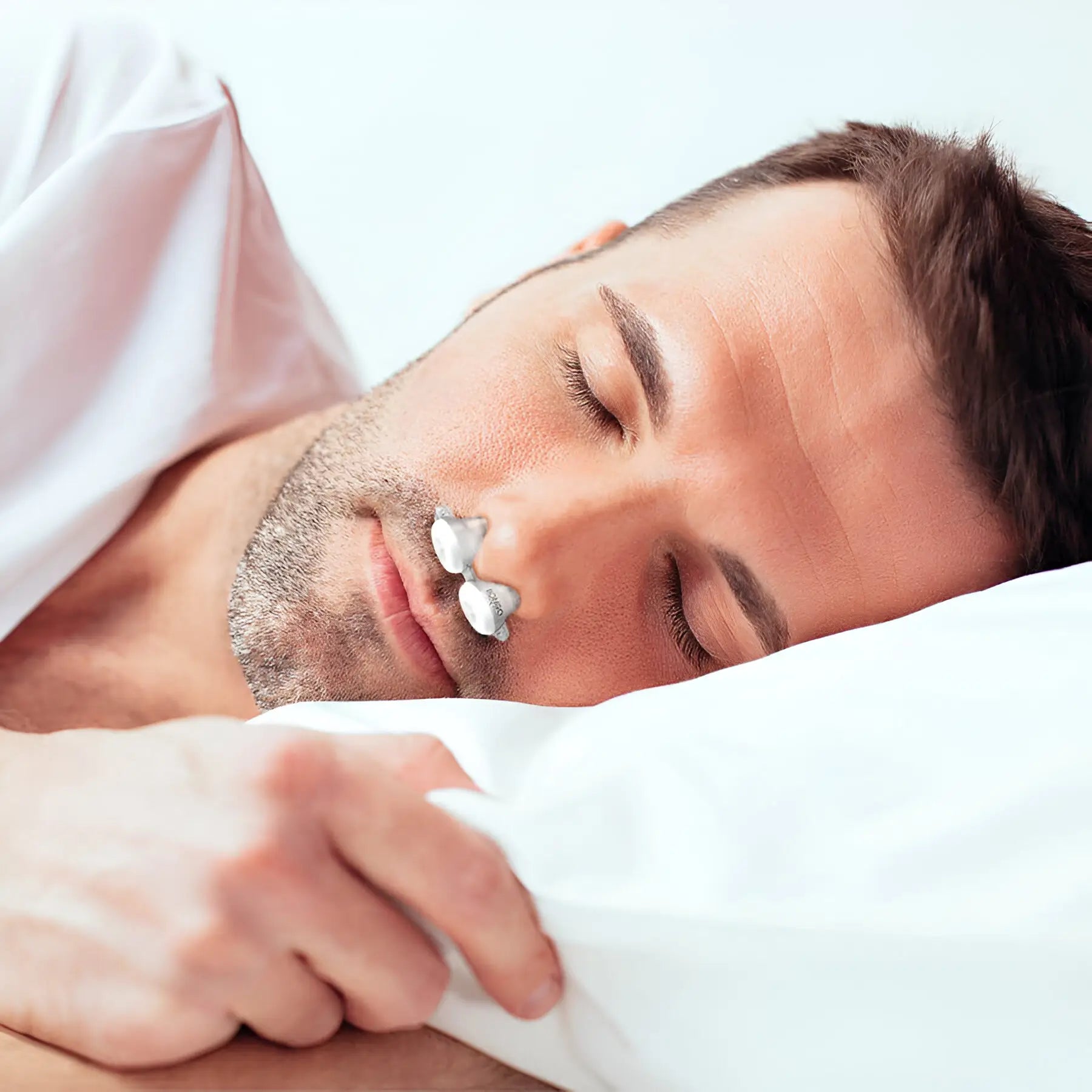 man using the Bongo RX Sleep Apnea Therapy without the headgear 