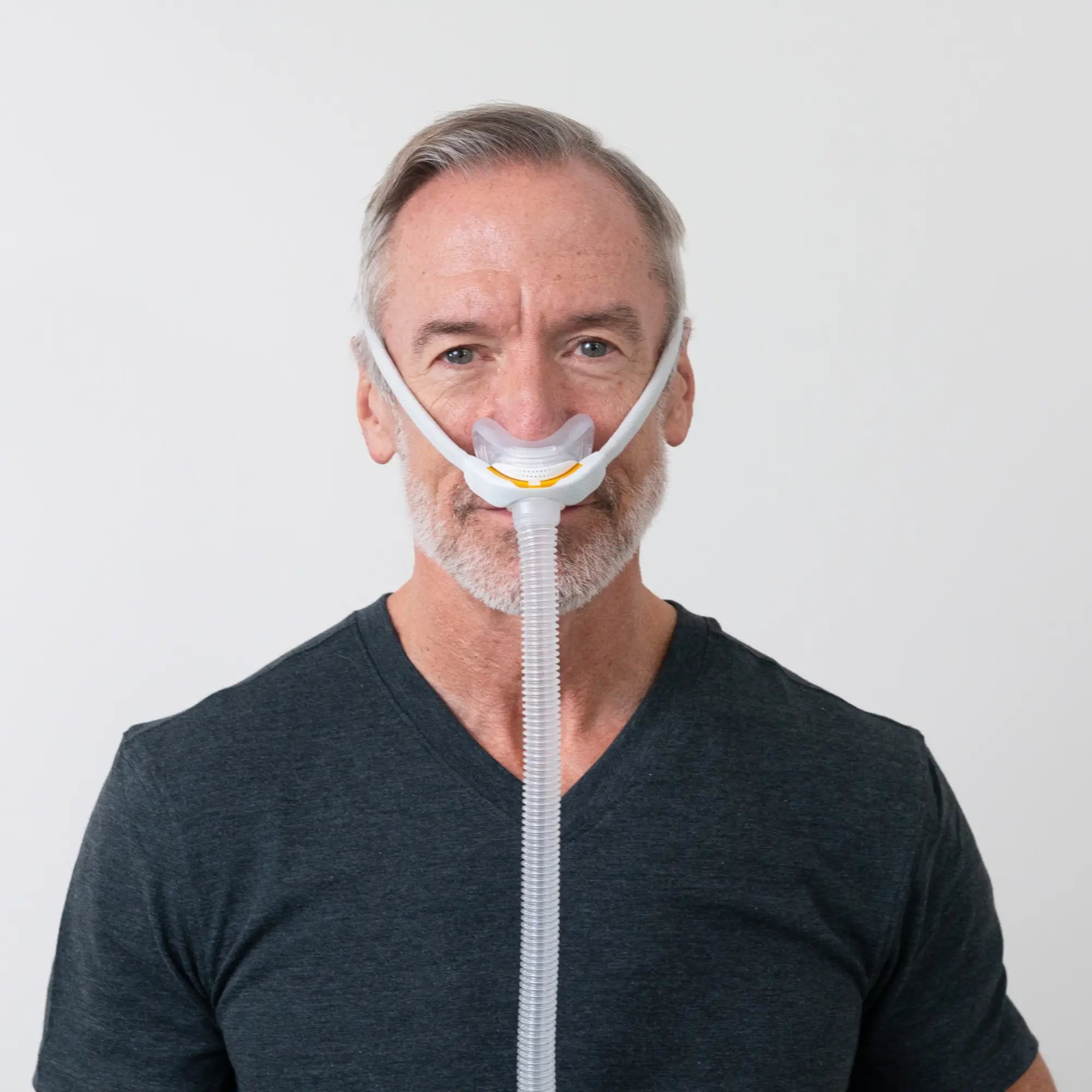 man using the F&P Solo Nasal CPAP Mask Autofit front view