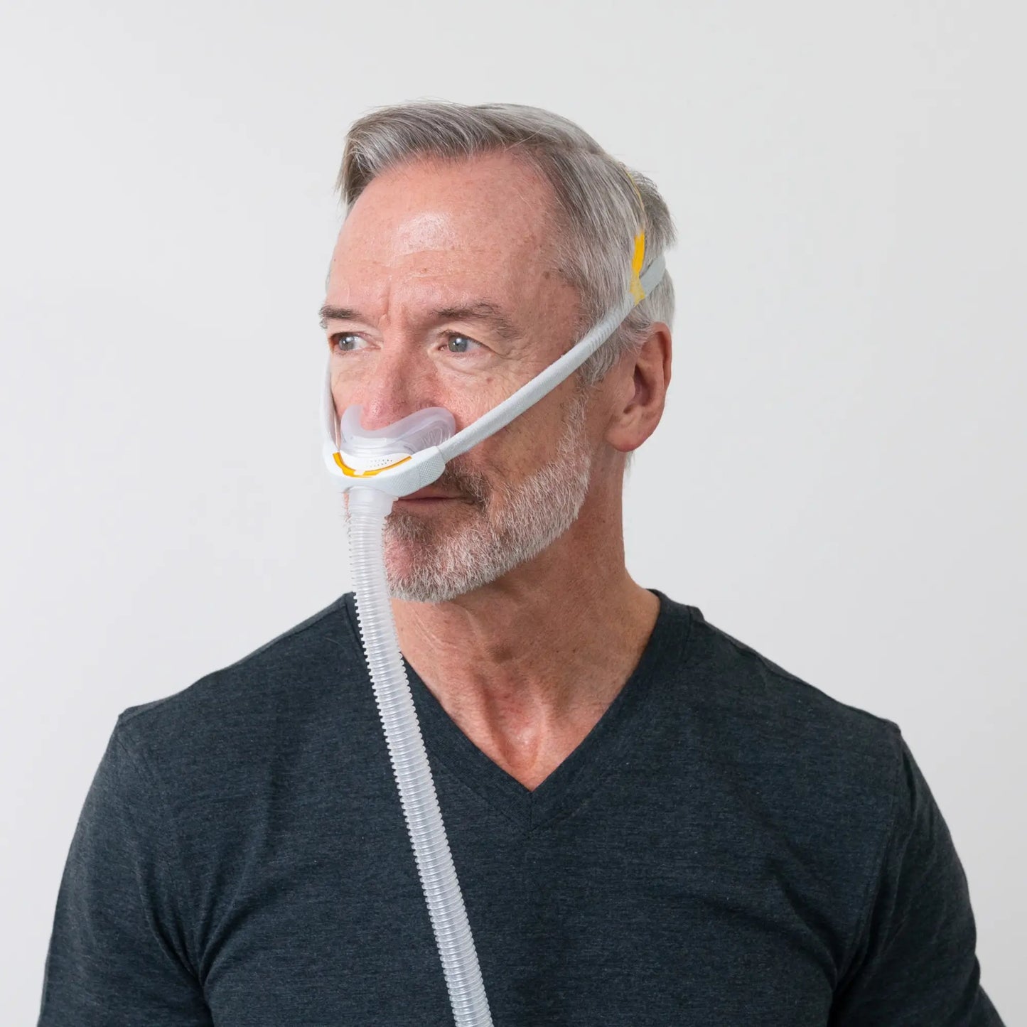 man using the F&P Solo Nasal CPAP Mask Autofit side view