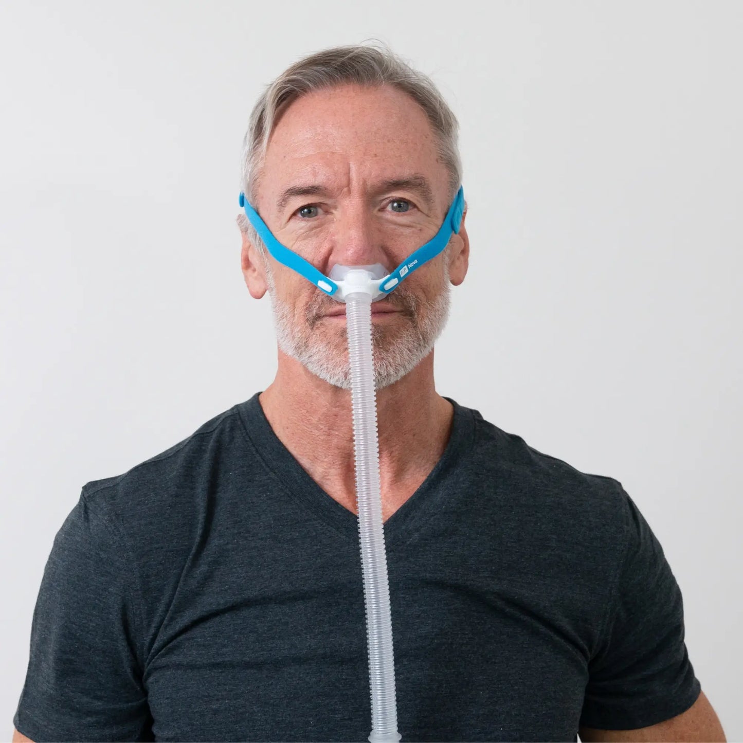 man using the F&P Nova Micro Nasal Pillows CPAP Mask front view sleeplay copyright 