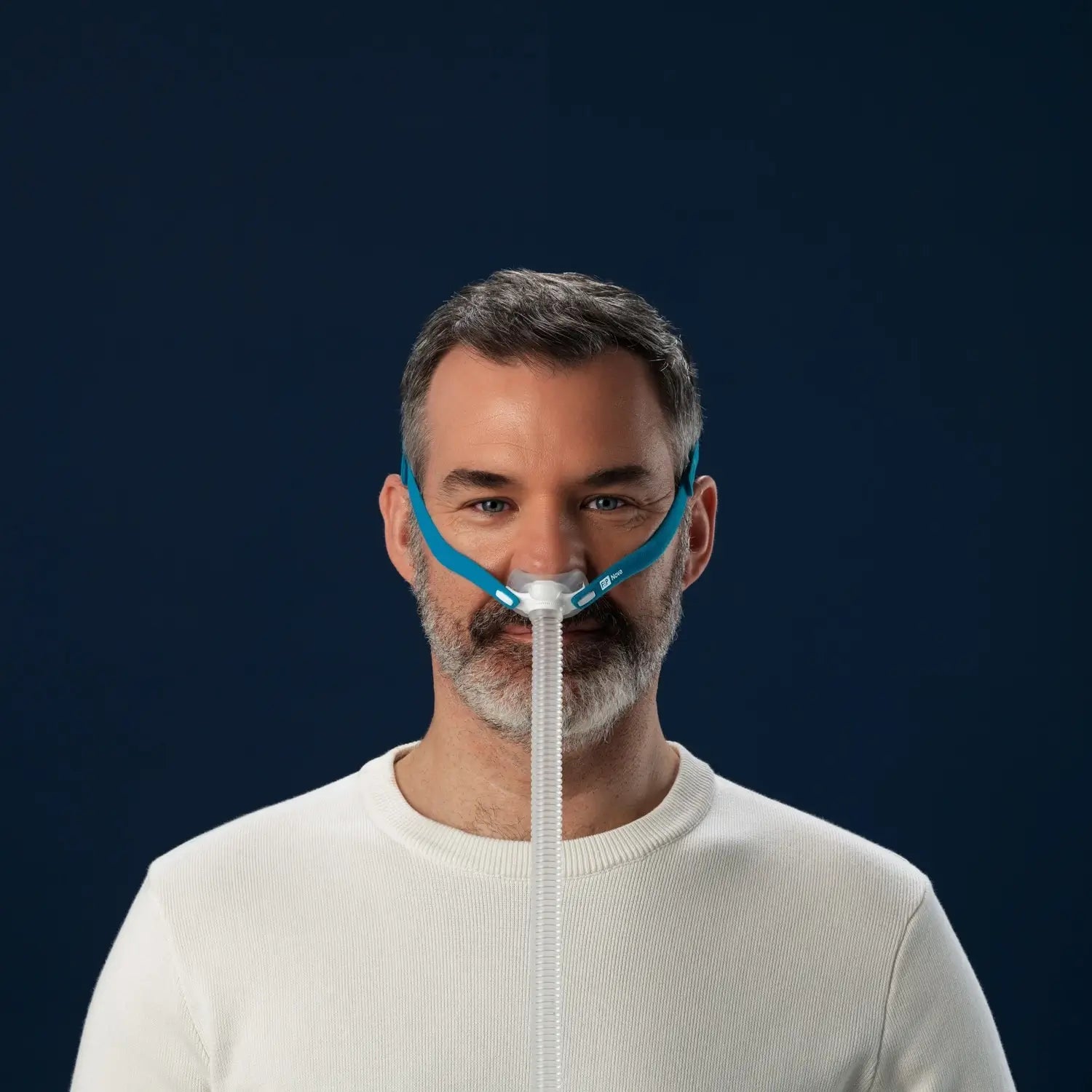 man using the F&P Nova Micro™ Nasal Pillows CPAP Mask front View