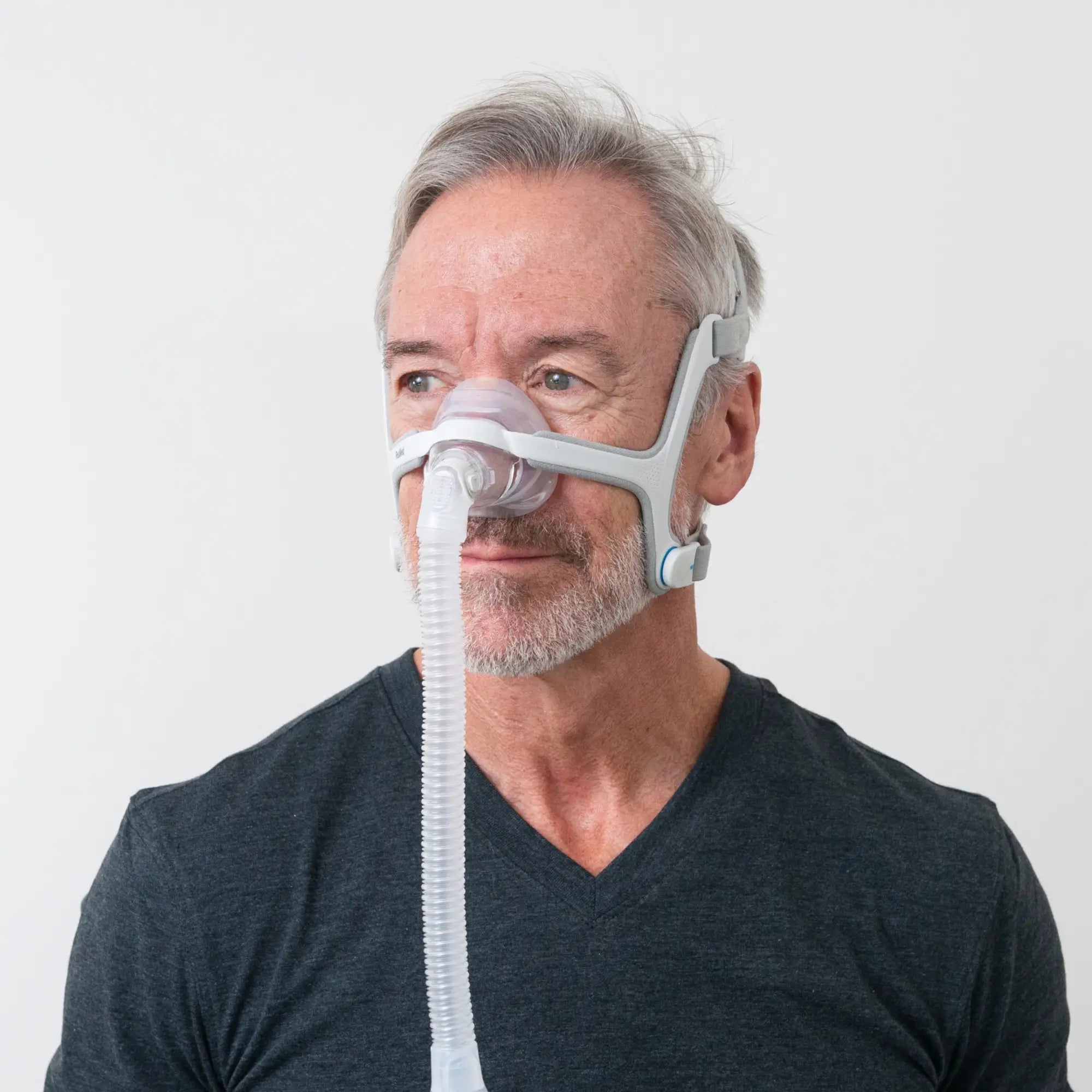 man using the ResMed AirFit N20 Nasal CPAP Mask with Headgear side view