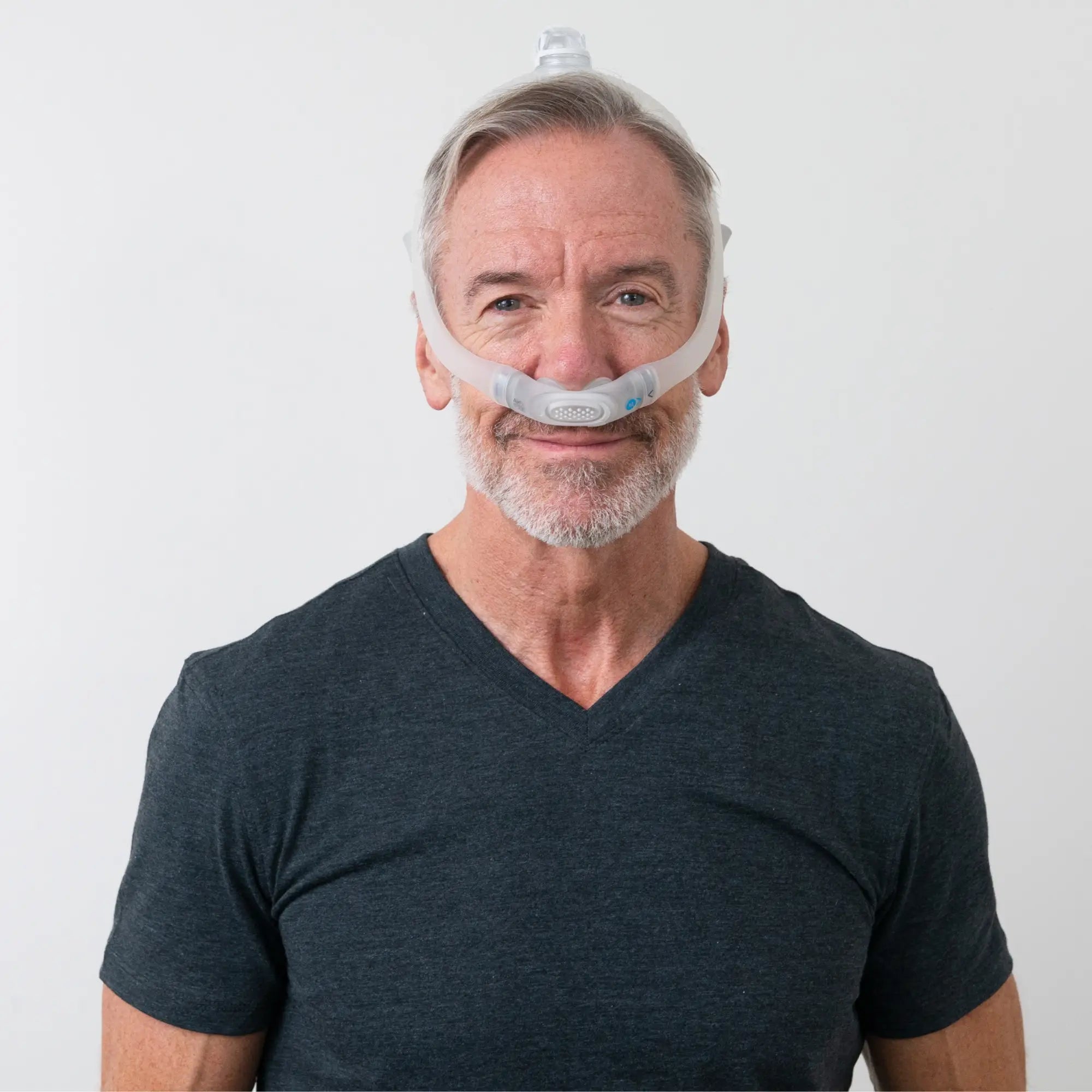 man wearing the ResMed AirFit P30i Nasal Pillow Mask front