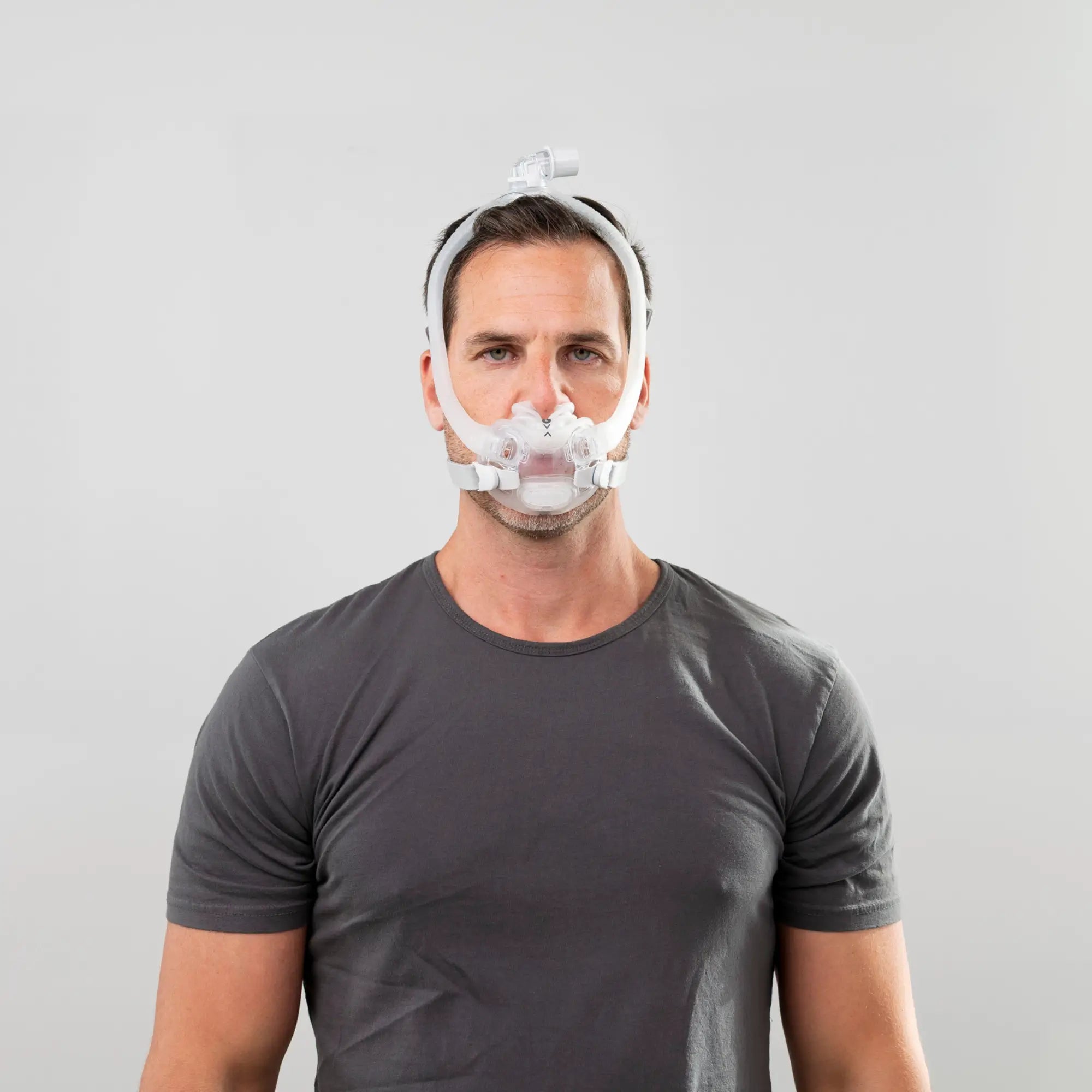 man using the resmed airfit x30i oral nasal full face cpap mask front view