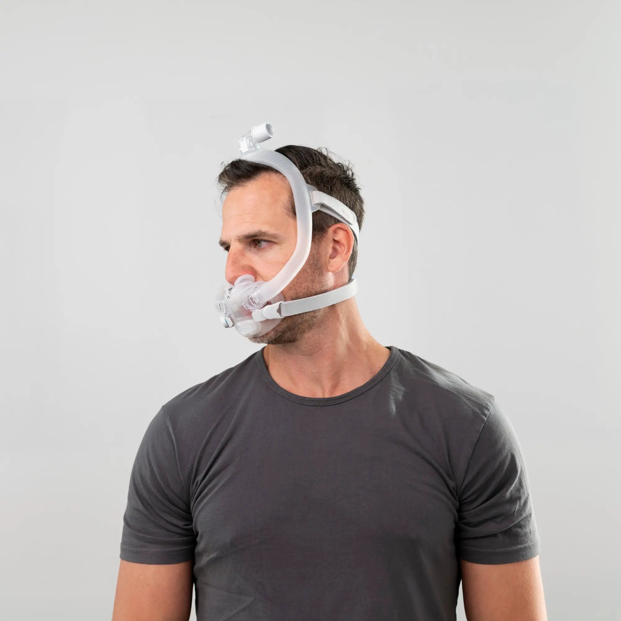 man using the resmed airfit x30i oral nasal full face cpap mask side view