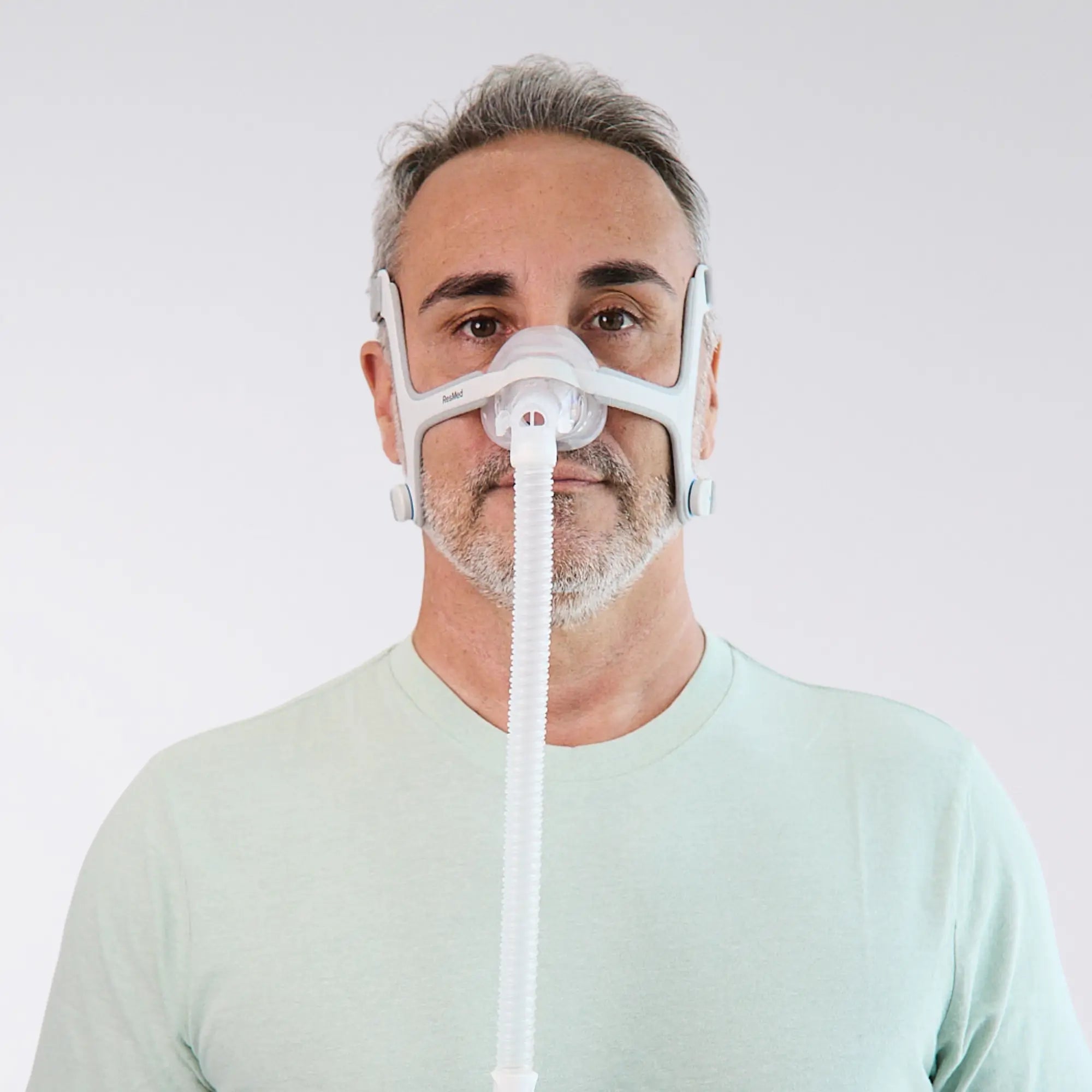 man using the ResMed AirTouch N20 Nasal Mask front view