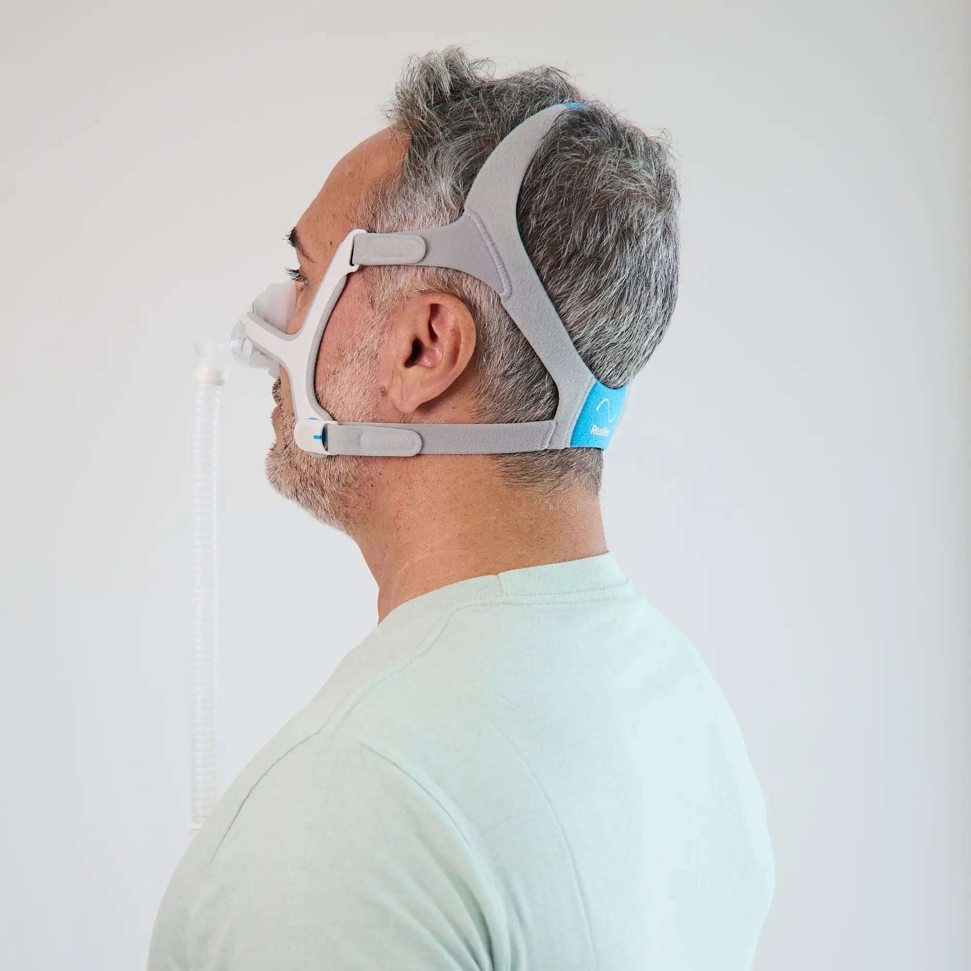 man using the ResMed AirTouch N20 Nasal Mask side view