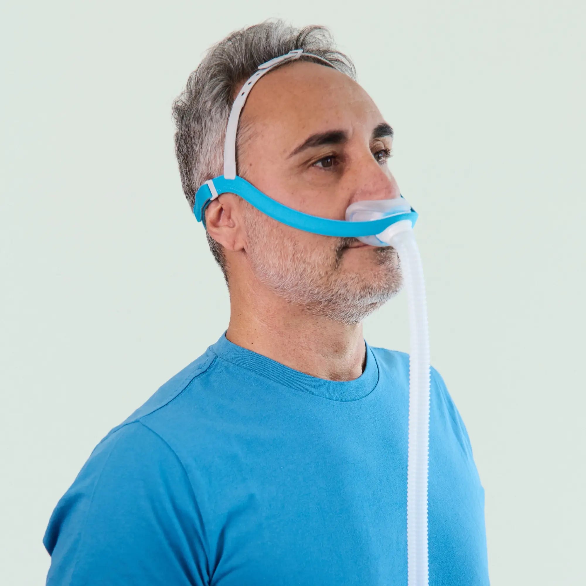 man wearing the Evora Nasal CPAP Mask side view