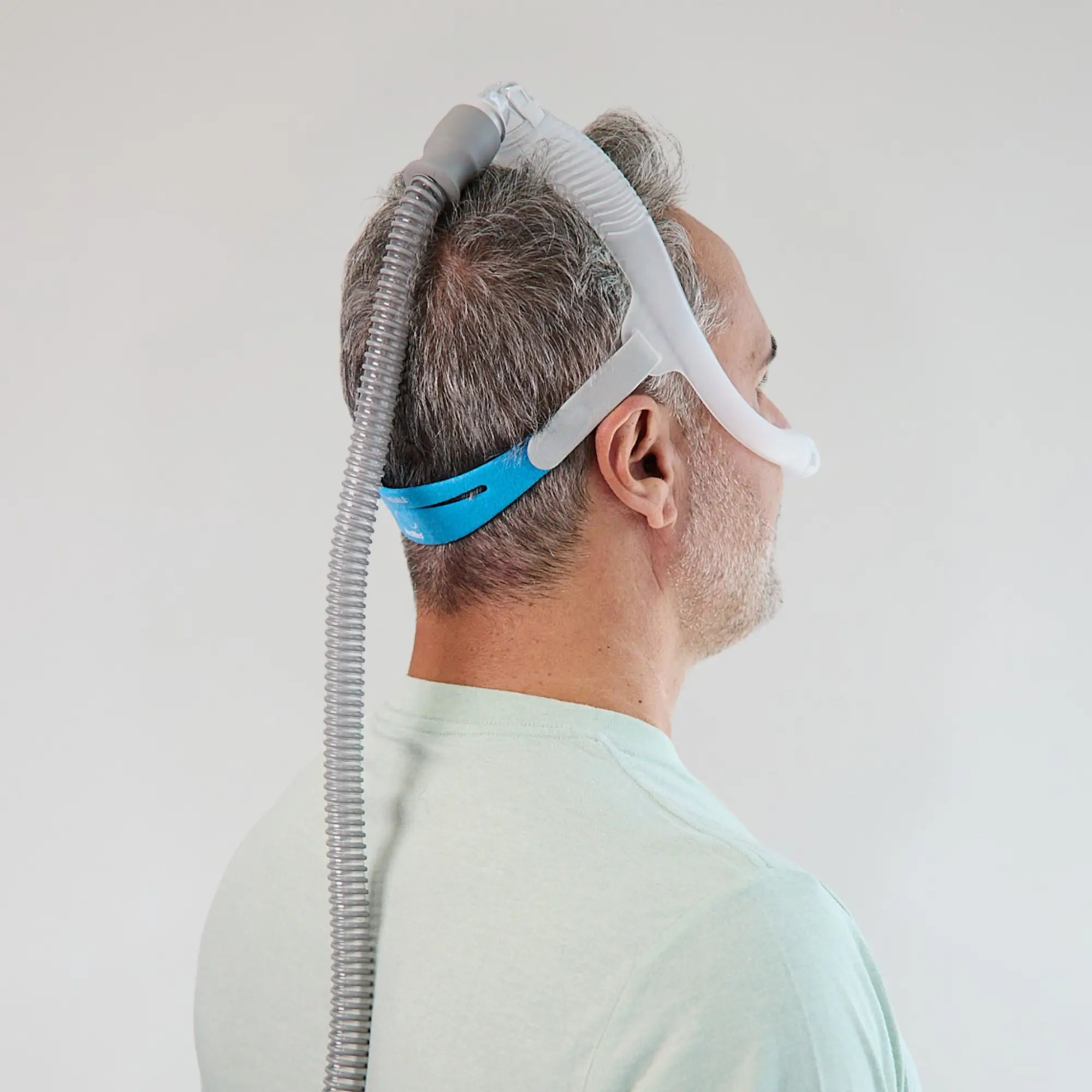 man wearing ResMed AirFit N30i Nasal Mask back side view