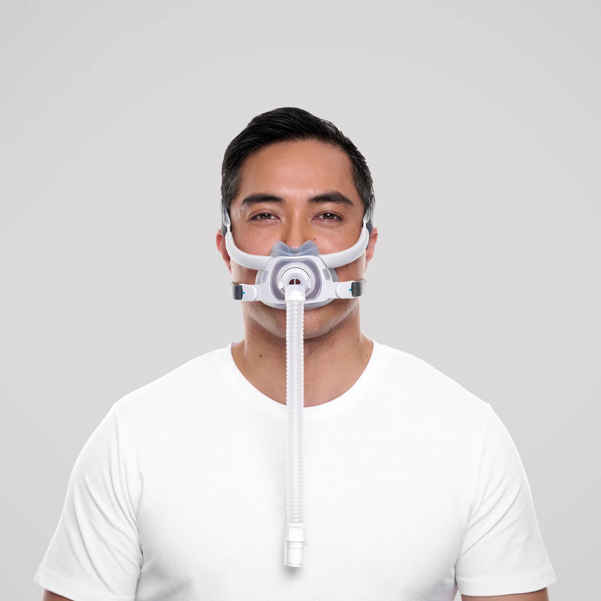 Man wearing the ResMed AirTouch F40 full face CPAP mask with tubing, front view