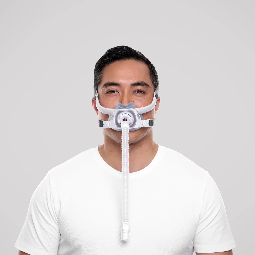 Man wearing the ResMed AirTouch F40 full face CPAP mask with tubing, front view
