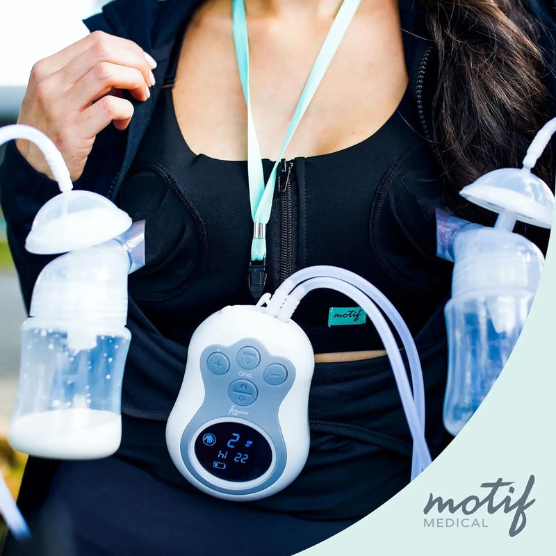 Motif Duo Breast Pump being used by a mother in a home setting, showcasing its practicality for multitasking parents.